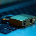 Padlock lying on a laptop keyboard
